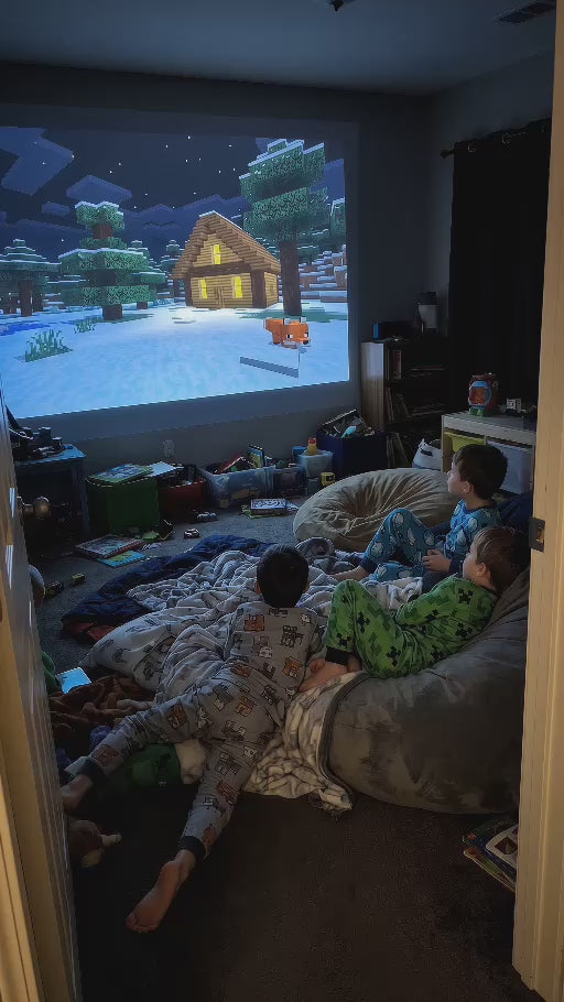 Minecraft snowy cabin projected in a dim bedroom