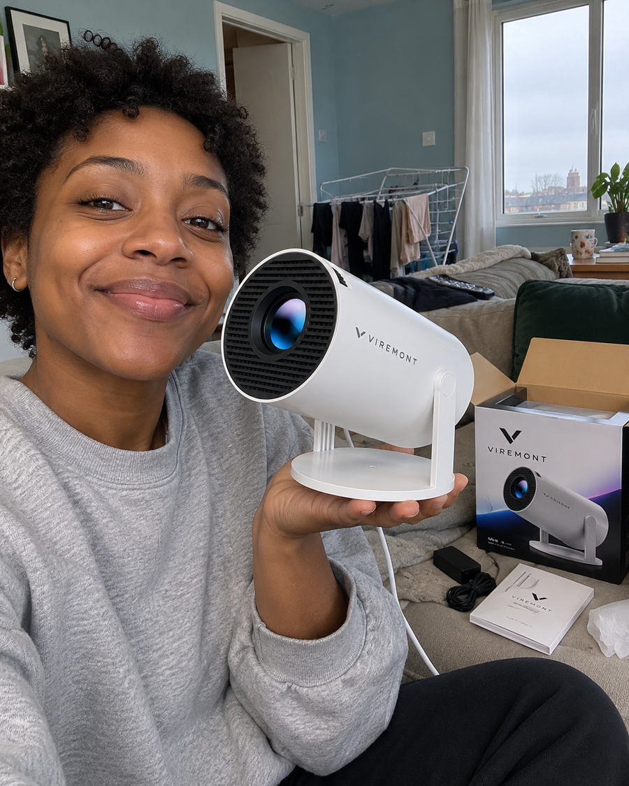 Illustrative Viremont setup: Selfie holding cylindrical projector beside packaging