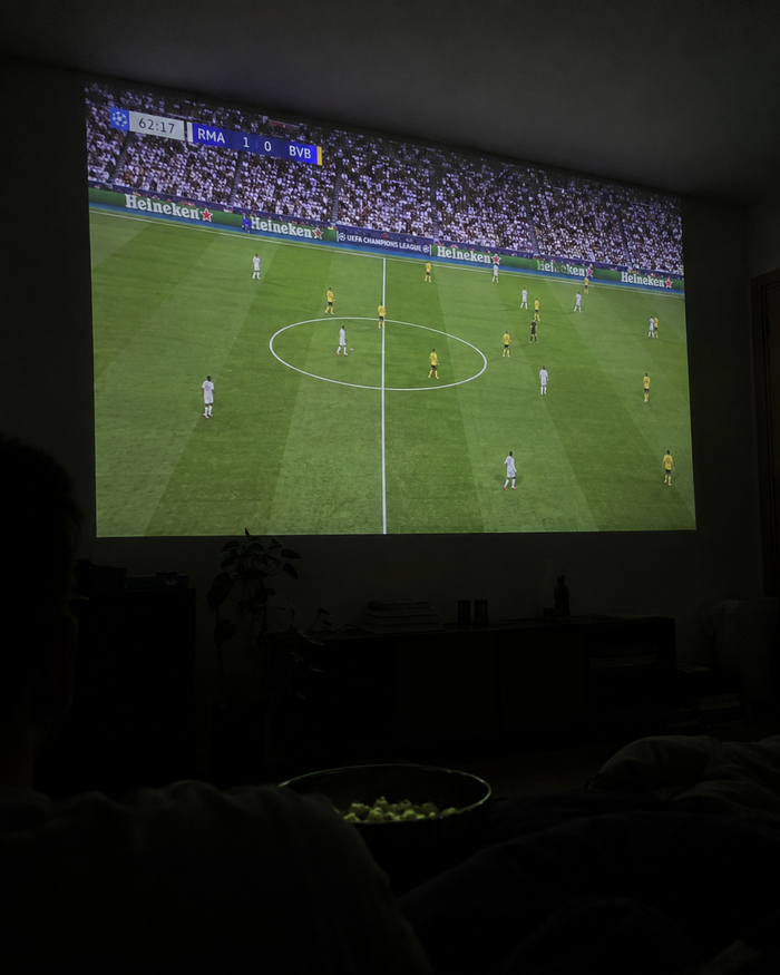 Illustrative Viremont setup: Soccer match projected in dark living room