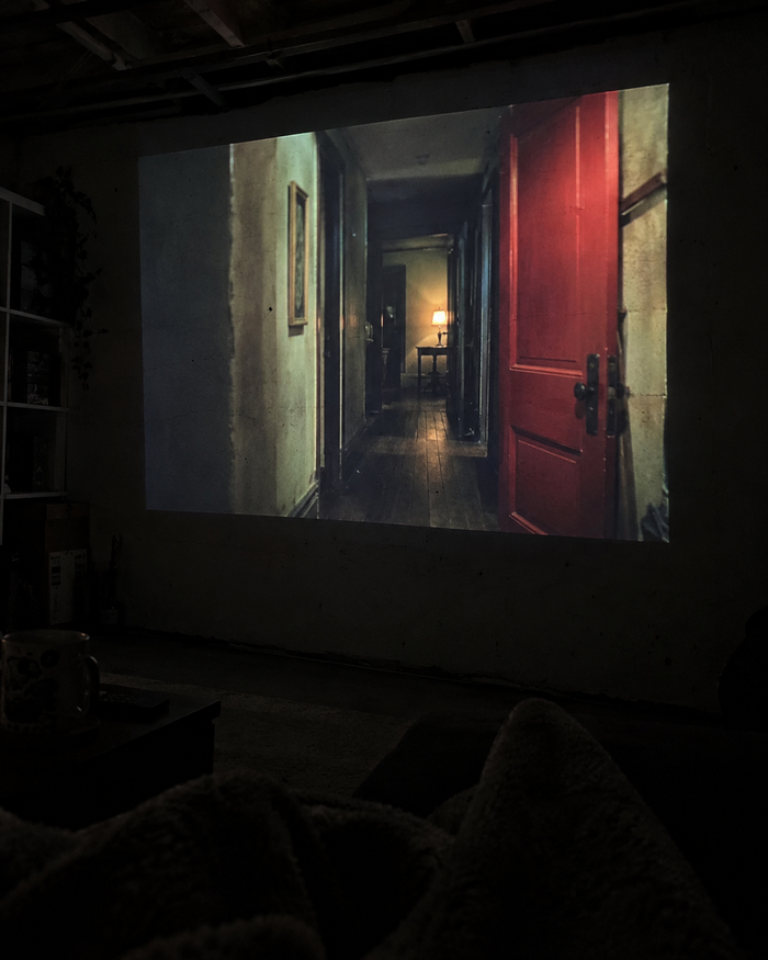 Illustrative Viremont setup: Suspense movie projected on painted basement wall