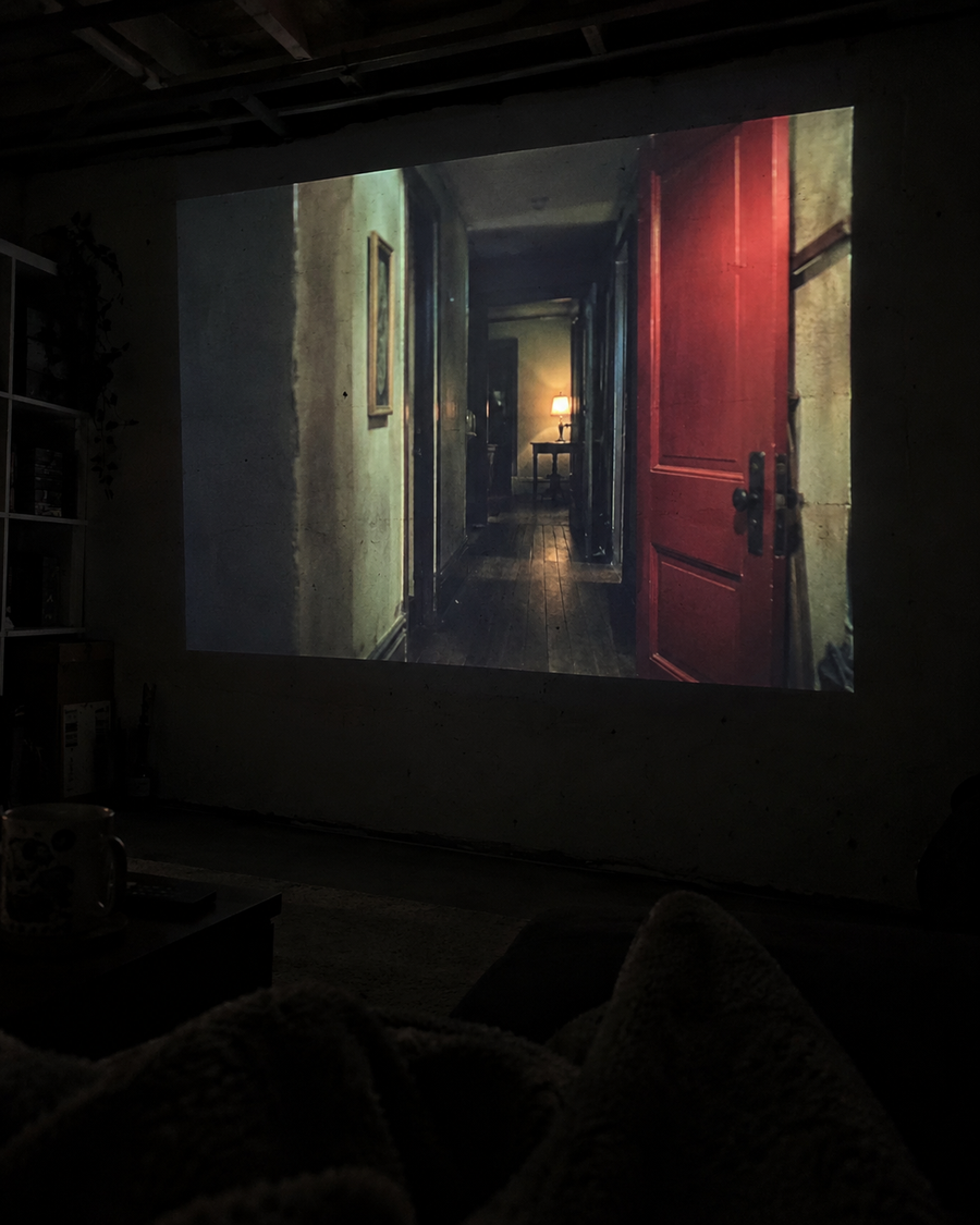 Illustrative Viremont setup: Suspense movie projected on painted basement wall
