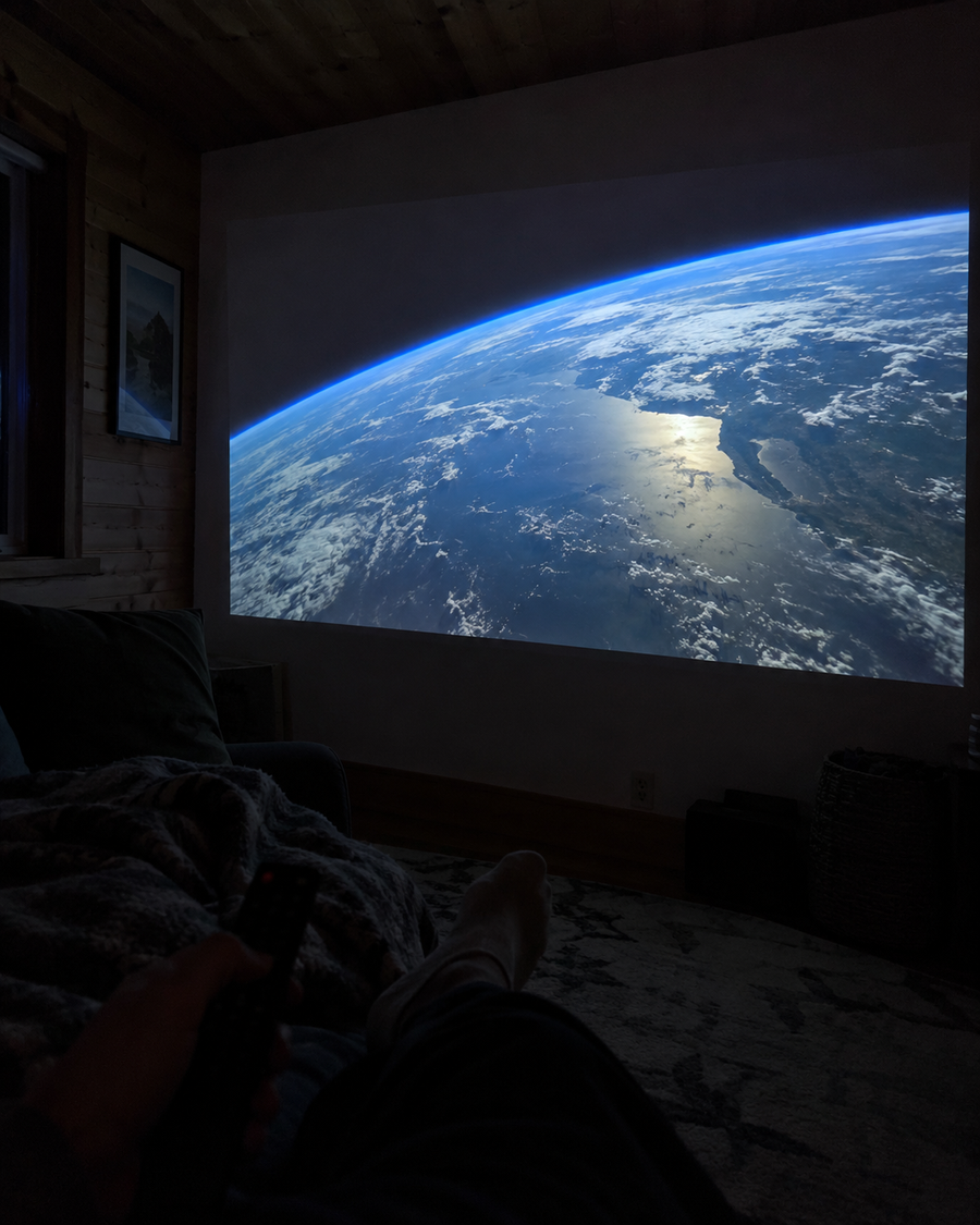 Illustrative Viremont setup: Space documentary projected in dark wood paneled room